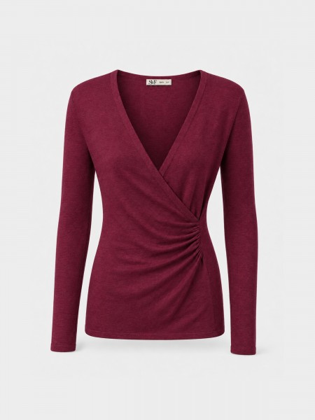 Knitted sweater with draping